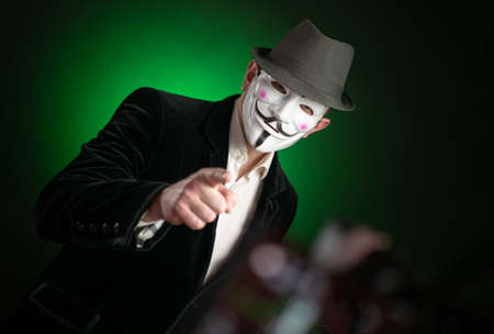 Russia - Belgorod - 02 May 2020 - Photo of Businessman wearing Vendetta mask. This mask is a well-known symbol for the online hacktivist group Anonymous.のeditorial素材