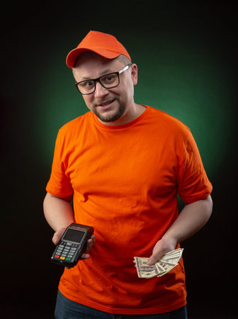 guy who delivers packages, food, courier with a cashless payment terminal