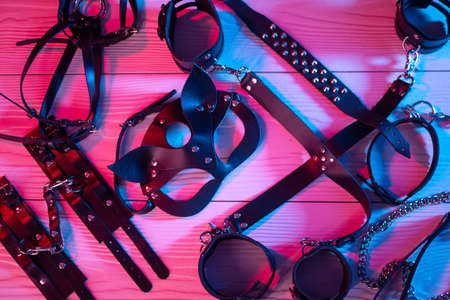the set of erotic toys for BDSM. The game of sexual slavery with a whip, gag and leather blindfold. Intimate sex gamesの写真素材