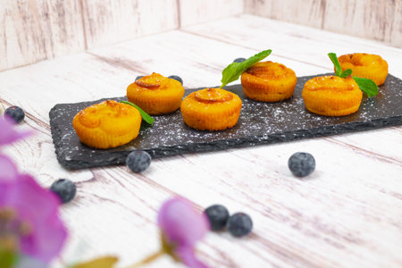 the Blueberry muffins with powdered sugar and fresh berries