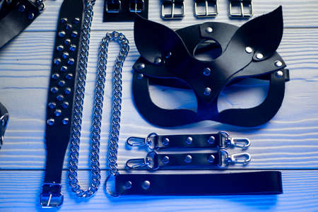 Set of erotic toys for BDSM. The game of sexual slavery with a whip, gag and leather blindfold. Intimate sex gamesの写真素材