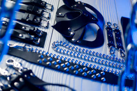 Set of erotic toys for BDSM. The game of sexual slavery with a whip, gag and leather blindfold. Intimate sex gamesの写真素材