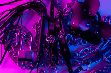 Set of erotic toys for BDSM. The game of sexual slavery with a whip, gag and leather blindfold. Intimate sex gamesの写真素材