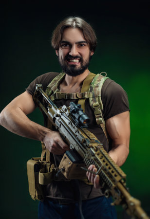 a bearded man with a pulimet in his handsの写真素材