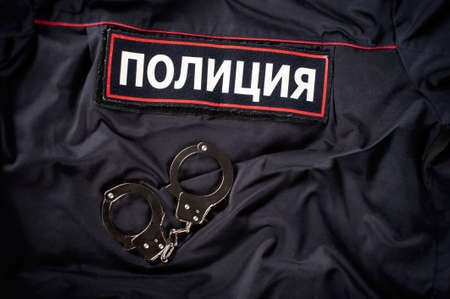 Russian Police Uniform with Handcuffs English Translation-Policeの写真素材