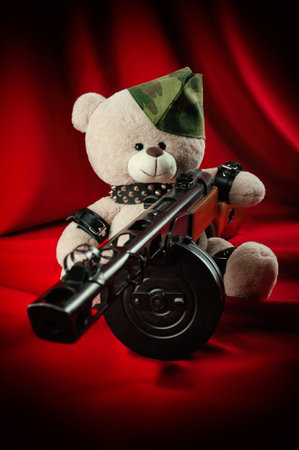 creative teddy bear in a military cap with a PPSH-41 machine gun symbol of the victory of the Red...