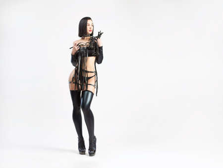 sexy lgbt brunette in leather latex open clothes bdsm and sex gamesの写真素材