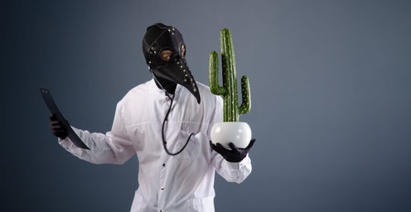 a doctor in a dressing gown, wearing a plague doctor mask with a cactus in his hands