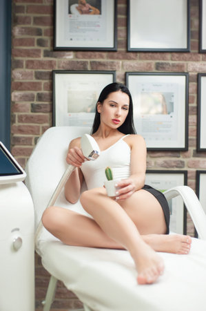 a woman in a laser hair removal studio with a maniple and a cactus in her hand as a symbol of hair...
