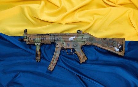 weapons and armor on the background of the flag of Ukraine