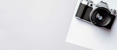 top view of retro camera on white background, panoramic shotの素材