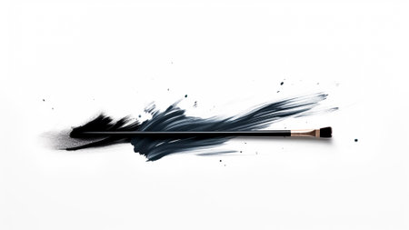 Cosmetic brush with a stroke of dark paint on a white background.の素材