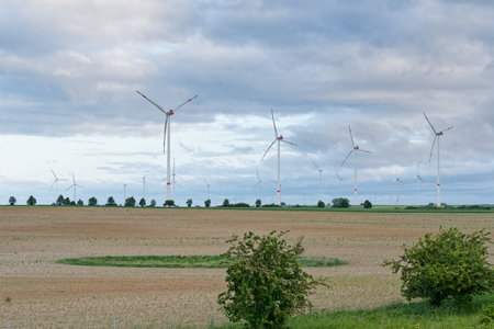 Wind turbines in a field in springtime in the netherlandsの写真素材