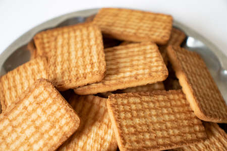 cashew cookies on white indian biscuits wheat biscuits in the steel plate white backgroundの写真素材
