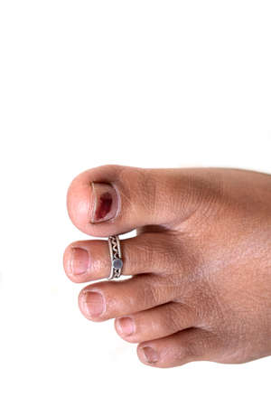 Indian women feet with silver ornament on white backgroundの写真素材