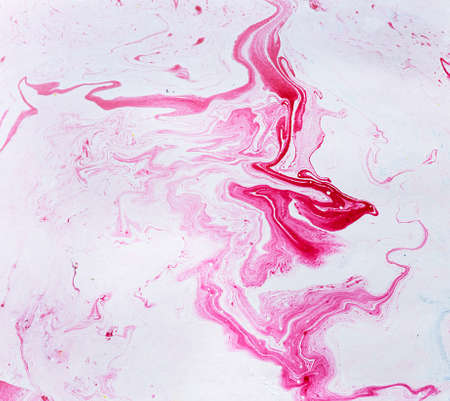 Abstract colorful red oil ink on paper close-up background textureの写真素材