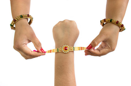 raksha Bandhan A sister is binding rakhi on her brother s hand on the occasion of raksha Bandhanの写真素材