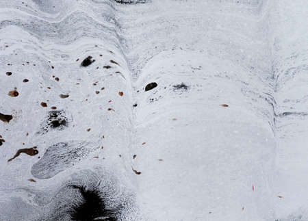 Abstract colorful black oil ink on paper close-up background textureの写真素材