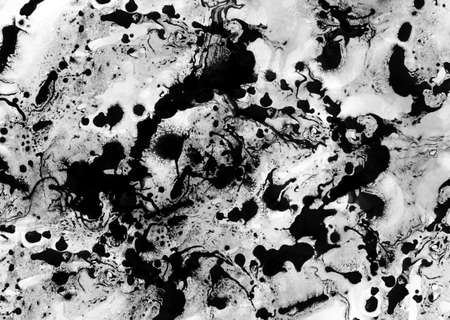 Abstract black oil ink on paper close-up background textureの写真素材