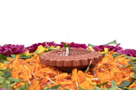 Flower Rangoli for Diwali Festival made using Marigold or Zendu flowers and Clay Oil Lampの写真素材