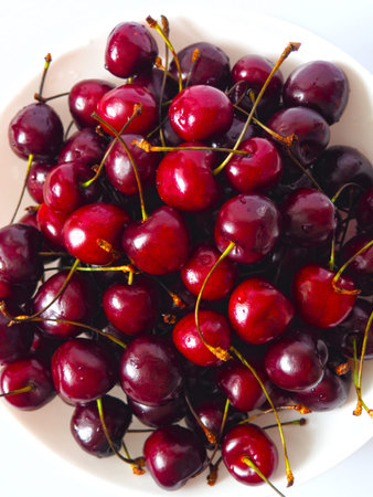 Fresh black sweet cherries close up. Natural food background