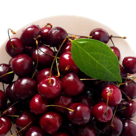 Fresh black sweet cherries close up. Natural food background
