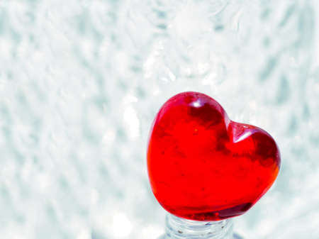 Heart shape transparent sugar candy close up image. Beautiful Valentine's day concept. Close up view, selective focus imageの写真素材
