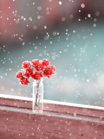 Colourful flying magical bokeh above pink rose flowers and blur soft focus blue background. Abstract backdrop art for paper texture, backdrop design conceptの写真素材