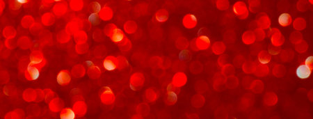 Holiday bokeh red lights background. Festive backdrop. Design for your ad, poster, banner. Social...