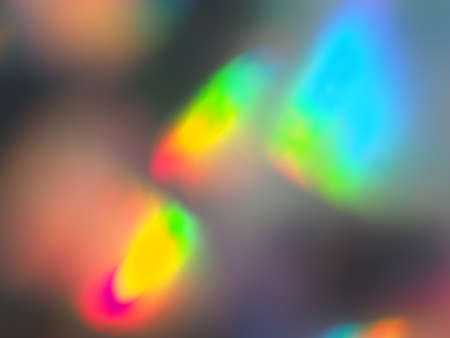 Holographic paper reflections bokeh background. Holiday backdrop. Design for your ad, poster, bannerの写真素材