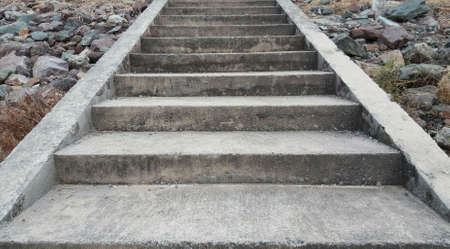 Concrete stairs with rocks beside.の写真素材