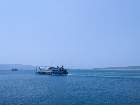 View of a ferry sailing on the ocean from the other side of the ferry boat.の写真素材
