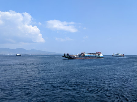 View of a ferry sailing on the ocean from the other side of the ferry boat.の写真素材