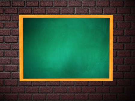 Illustration of blank green chalkboard in wooden frame on brick wall.の写真素材