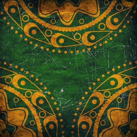 Abstract yellow ornament on grunge green background.の写真素材
