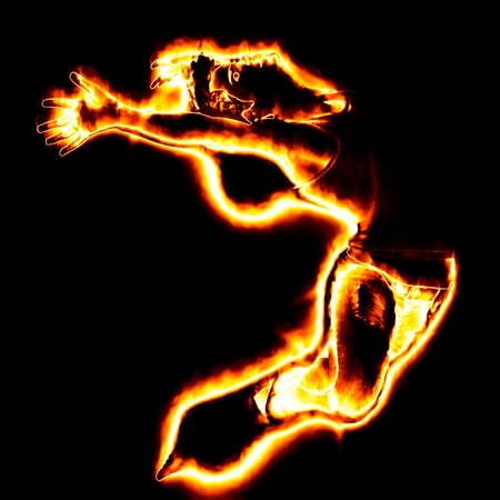 3d man from fire dancing on black background の写真素材