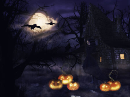 A spooky witch house at night with halloween pumpkins and a witch.の写真素材