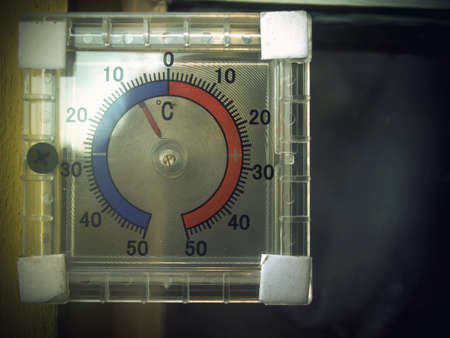 Thermometer outside during the winter time, cold weather.の写真素材