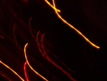 Abstract colorful light streaks texture with dark background.の写真素材