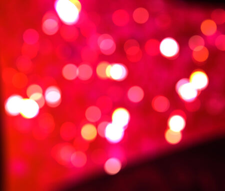 Bright pink background with bokeh light effect.の写真素材