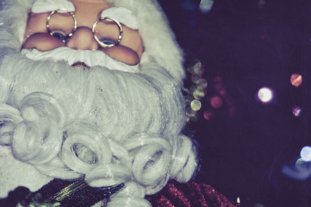 Christmas santa toy playing the accordion, vintage photo effect background.の写真素材