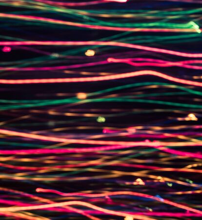 Colorful lights blurred in motion as abstract background.の写真素材