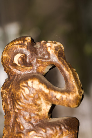 Macro of small wooden statuette of monkey.の写真素材