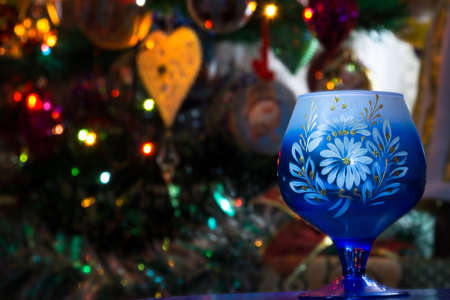 Decorative empty glass of blue color on colorful background.の写真素材