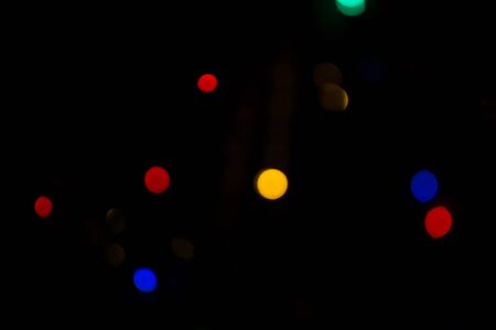 Defocused Christmas tree lights, colorful bokeh background.の写真素材