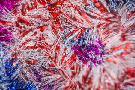 Colored decorative Christmas tinsel texture as holiday background.の写真素材