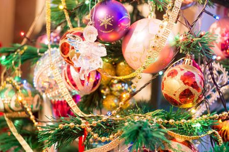 Holiday background with decorations on Christmas tree.の写真素材