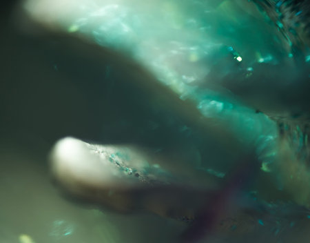 Extremely close up photo of glittering surface, abstract background.の写真素材