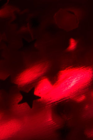 Pink lava lamp with bright stars in the dark, close up.の写真素材