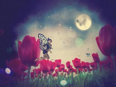 Dream fairy in fantasy land with bright red tulips at night time.の写真素材